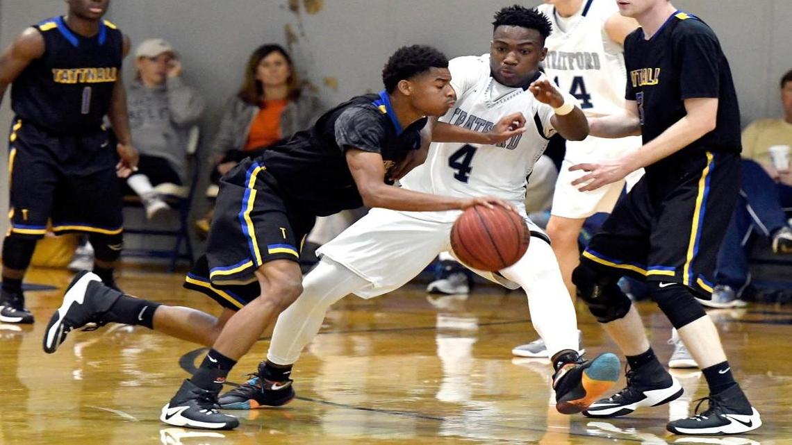 Tattnall’s Calvin Slaughter (0) drives by Stratford's Tyler Jordan (4) during their game Tuesday night.