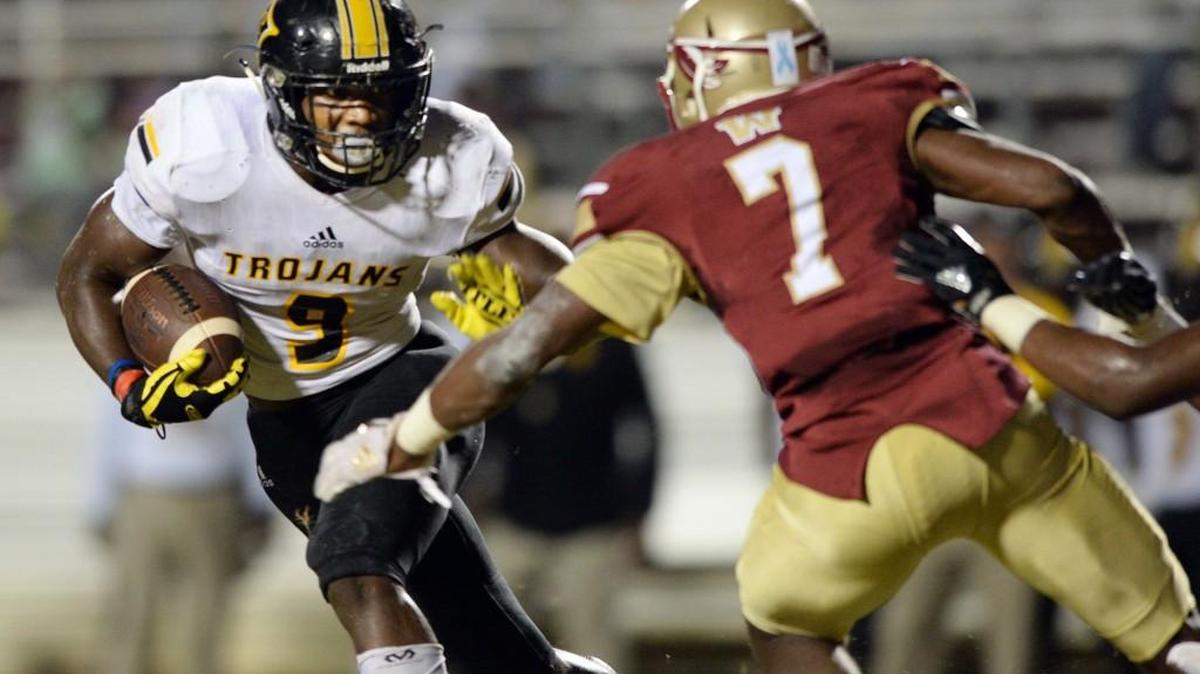 Peach County running back Trevon Woolfolk (9) and the Trojans opened GHSA Region 4-3A play Friday with a win at Westside.