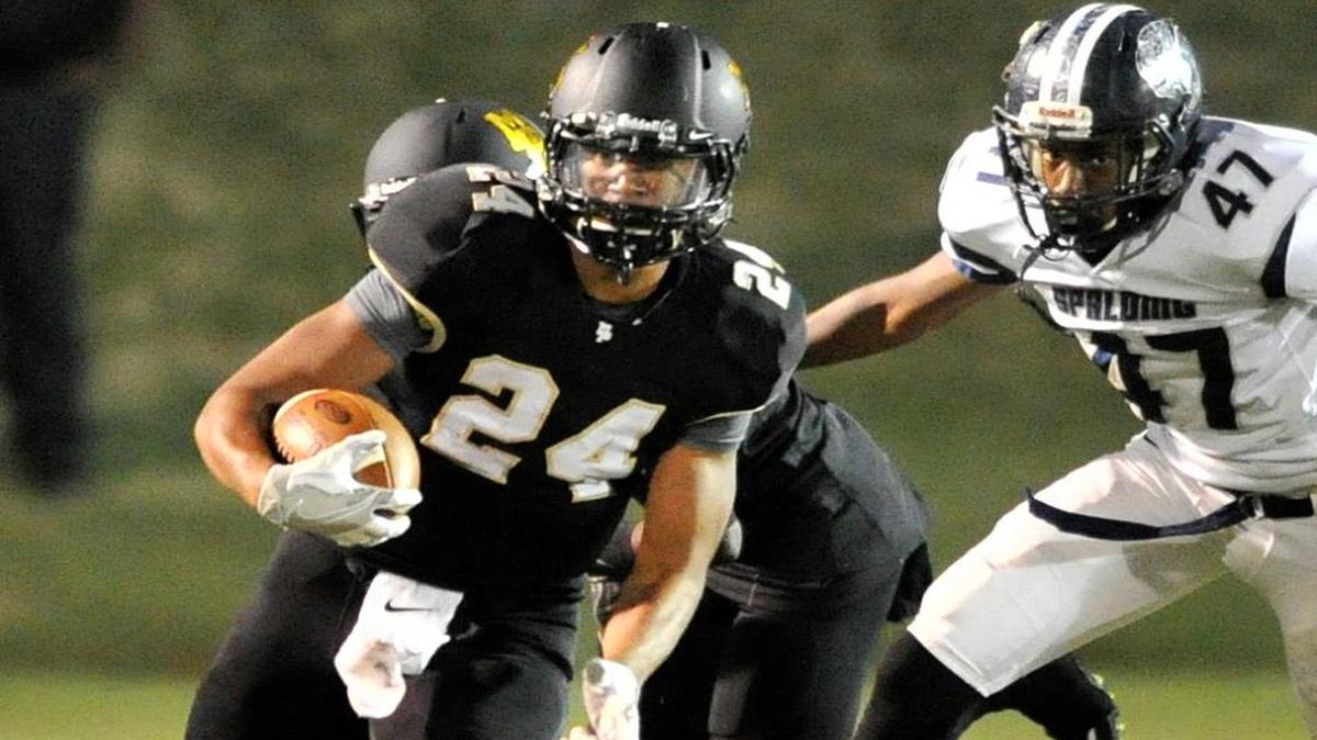 Mary Persons running back Zach Harvey cuts around the end and heads for a first down Friday night against Spalding.