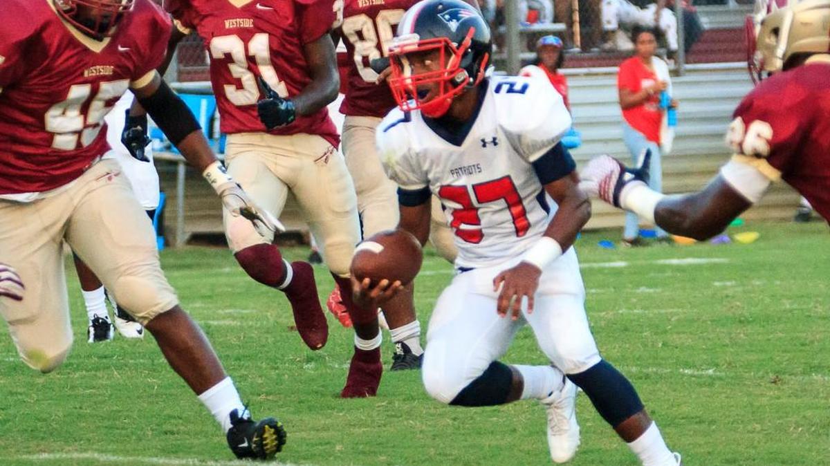 Southwest's Jaquavious Jones (27) runs up the middle in the 1st half of their game Friday night against Southwest
