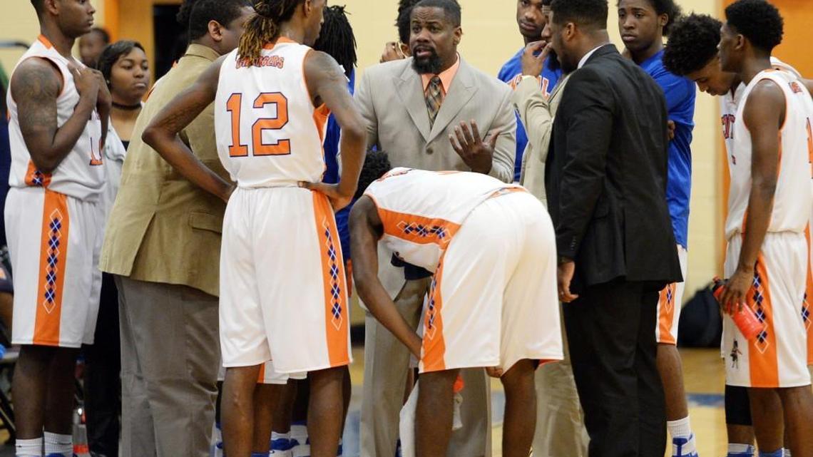 Central head coach Andre Taylor center rallies his Chargers during a second-half timeout. Central beat Peach County, 87-56.