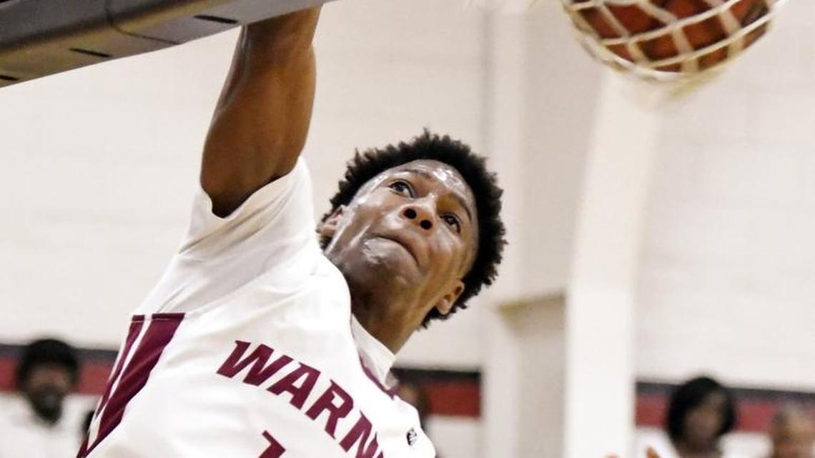 Warner Robins' Nelson Phillips (10) throws down a dunk during the Demons’ win Saturday in the GHSA Class 5A playoffs.