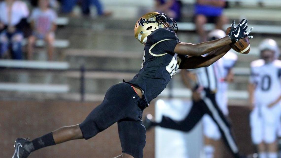 Mary Persons wide receiver Deadrek Alford stretches out to haul in a pass from quarterback J.T. Hartage on Friday.