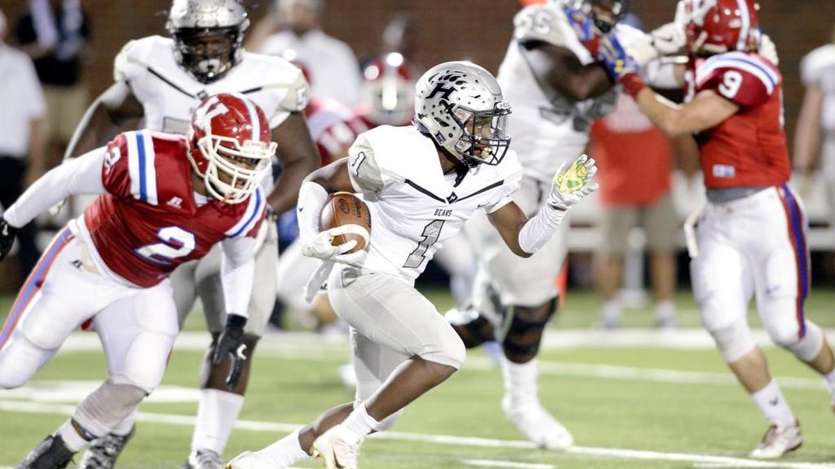 Houston County running back Jaeven West (1) runs by a Veterans defender during their game against Veterans Friday night.