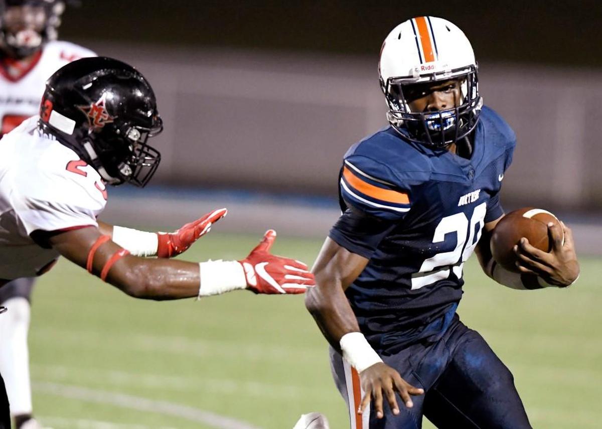 Northside running back Eric Smith (29) avoids a tackle during their game against Macon County.
