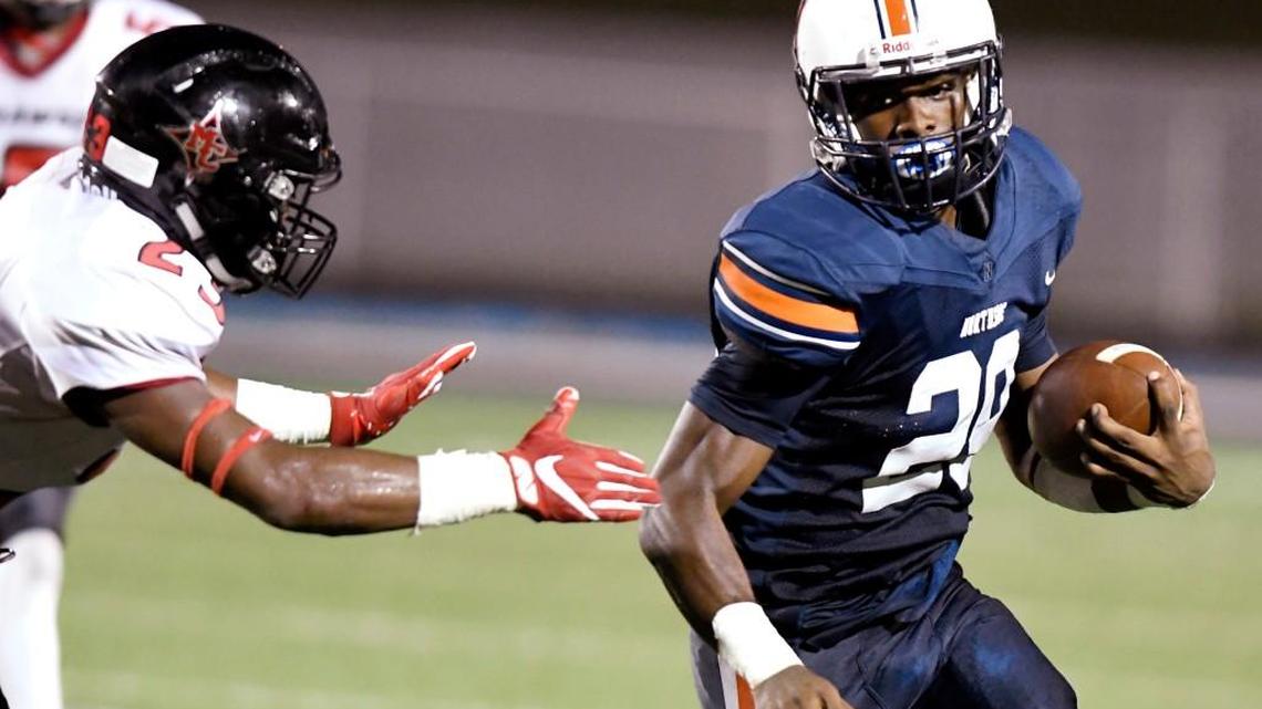 Northside running back Eric Smith (29) avoids a tackle during their game against Macon County.