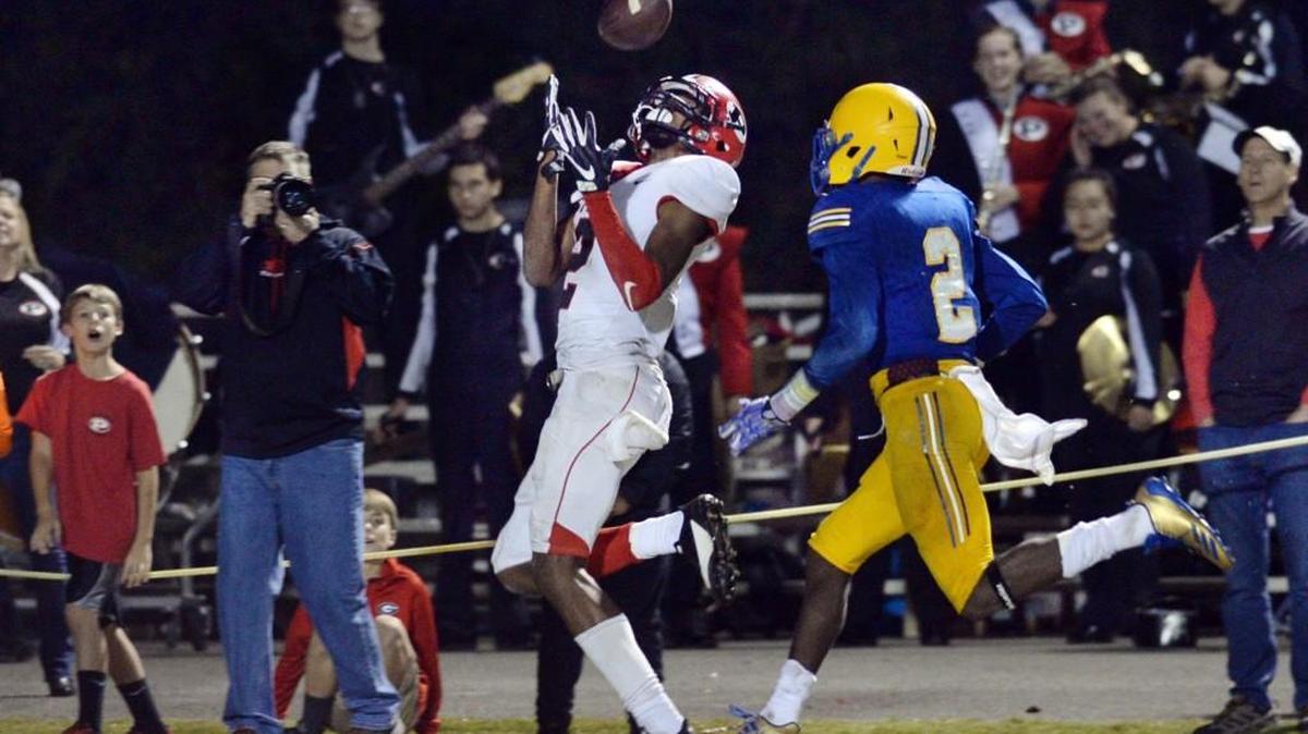 FPD's Maurice Gordon (2) hauls in a bomb from Dalton Cox with Jamal Marshall (2) defending in the fourth quarter to give the Vikings a 35-28 lead.