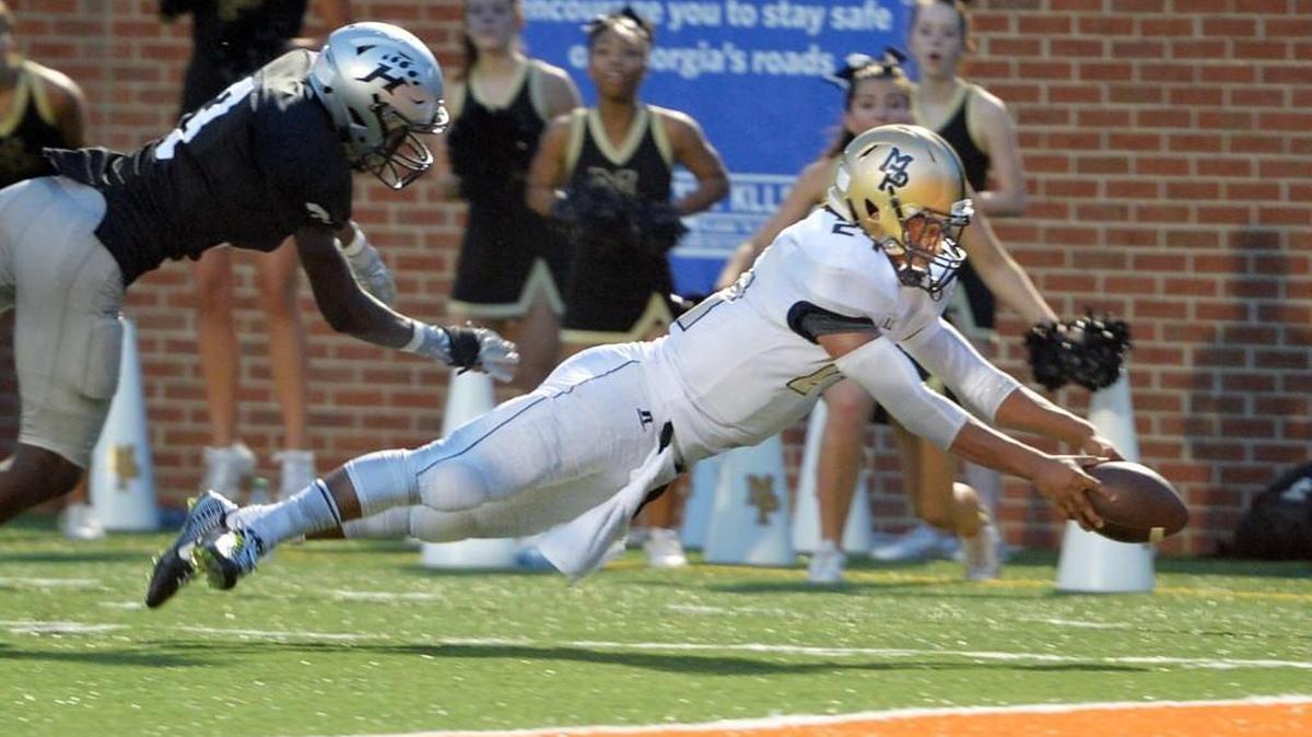 Mary Persons running back Zach Harvey (24) dives into the end zone during the Bulldogs’ Aug. 18 loss to Houston County. Mary Persons is at Jackson on Friday.