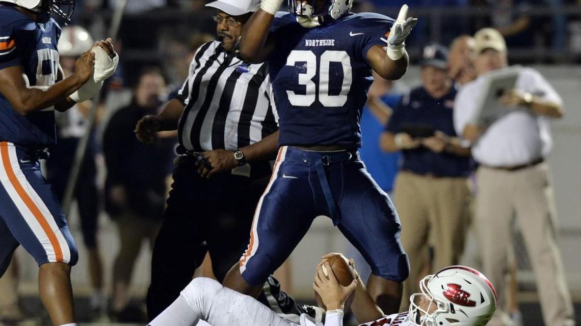 Northside linebacker Kameron Tate (30) gives himself a hand after sacking Lee County quarterback Jase Orndorff during first-half action.