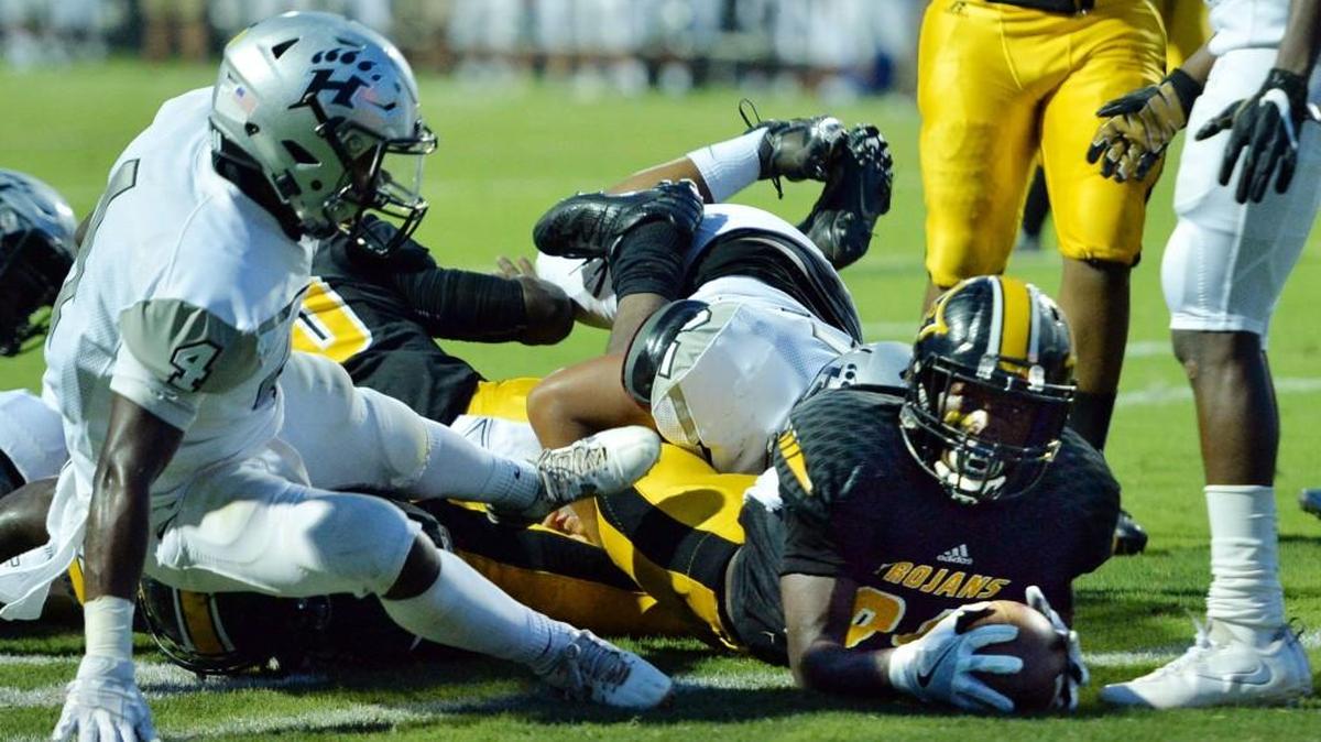 Peach County running back James Jackson (99) plunges into the end zone during last Friday’s game against Houston County. He has an ankle injury and is doubtful for this Friday’s game against Warner Robins.