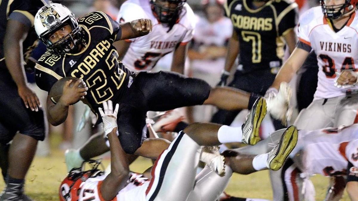 Twiggs County running back Ja'mon Height (22) lunges for extra yards during their game Friday against FPD.