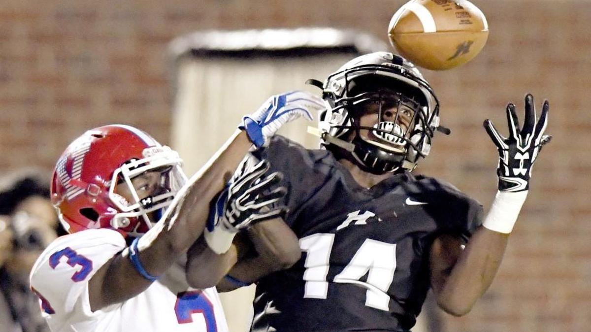 Veterans defensive back Justin Stevens (3) breaks up a pass intended for Houston County receiver Kyah Plummer (14) during their game on Friday night.