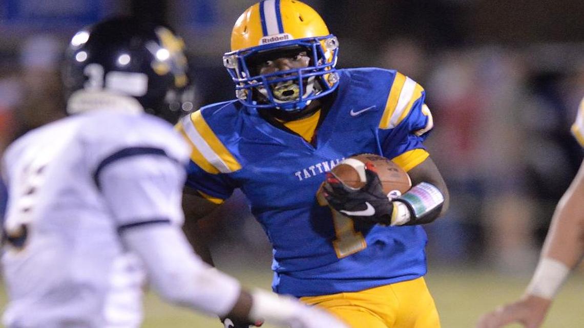 Tattnall's Ahmad Barron swings around the end and heads for a first down against Mount de Sales on Friday night.