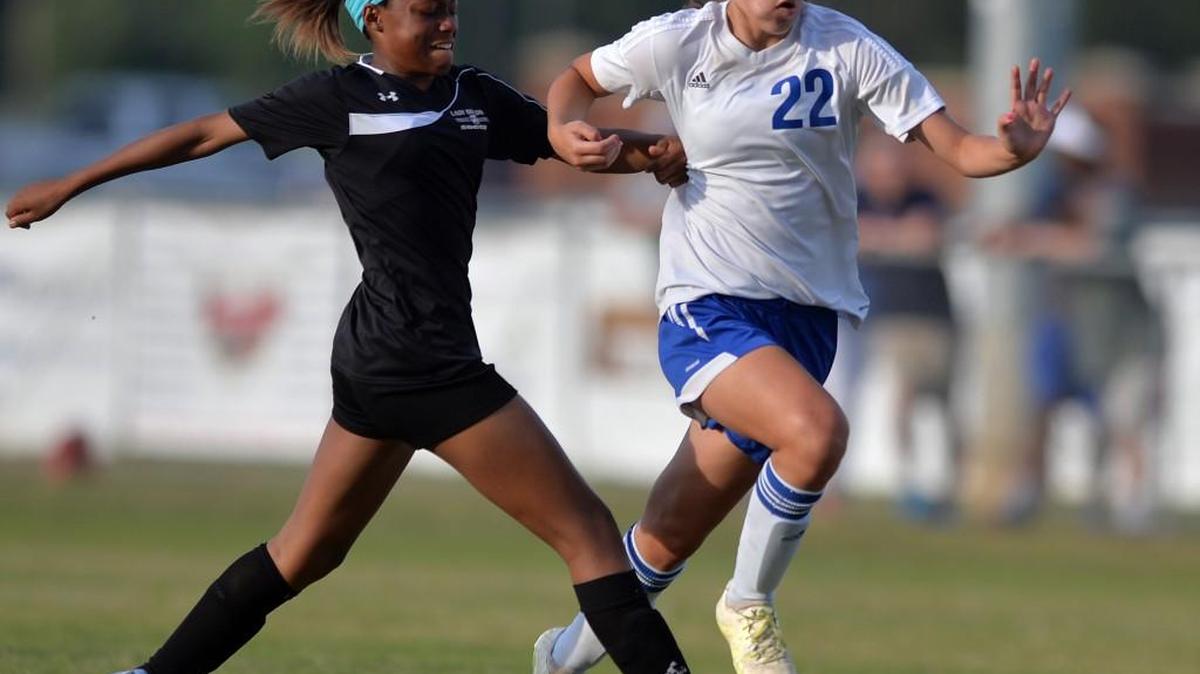 Veterans’ Sage Semelli, right, carves her way through the midfield against Thomson during their GHSA Class AAAA girls soccer playoff game Wednesday.