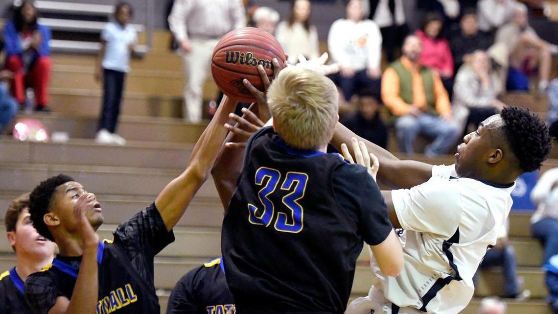 Tattnall Square and Stratford players battle for a rebound during their game Tuesday night.