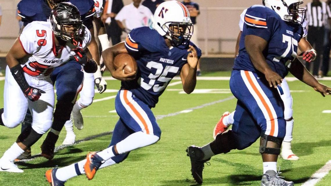 Northside's Daniel Neal (35) runs up the middle for a big gain against Macon County in the first half of their game Friday night.