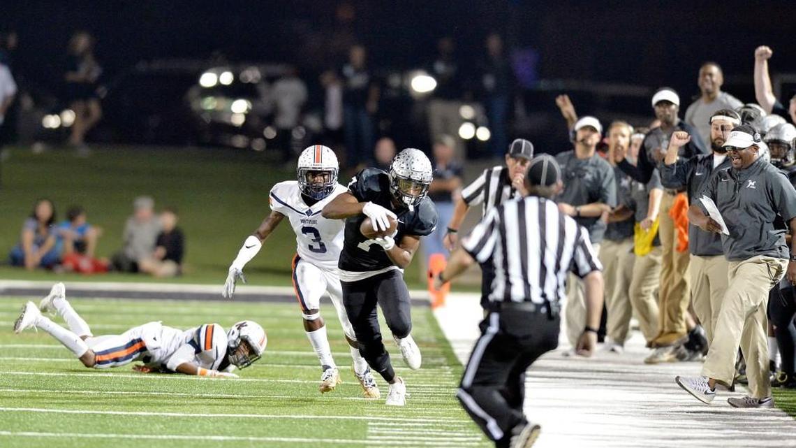 The Houston County bench erupts after receiver Amari Colbert (7) controls a tipped pass along the sideline during their game Friday night against Northside.