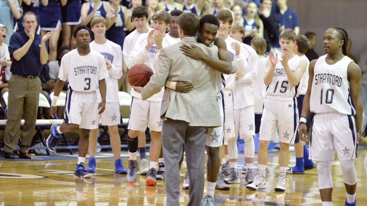 Stratford's Quintez Cephus (23) is congratulated by head coach Jamie Dickey after breaking the school's scoring record during their game against First Presbyterian January 23, 2015.