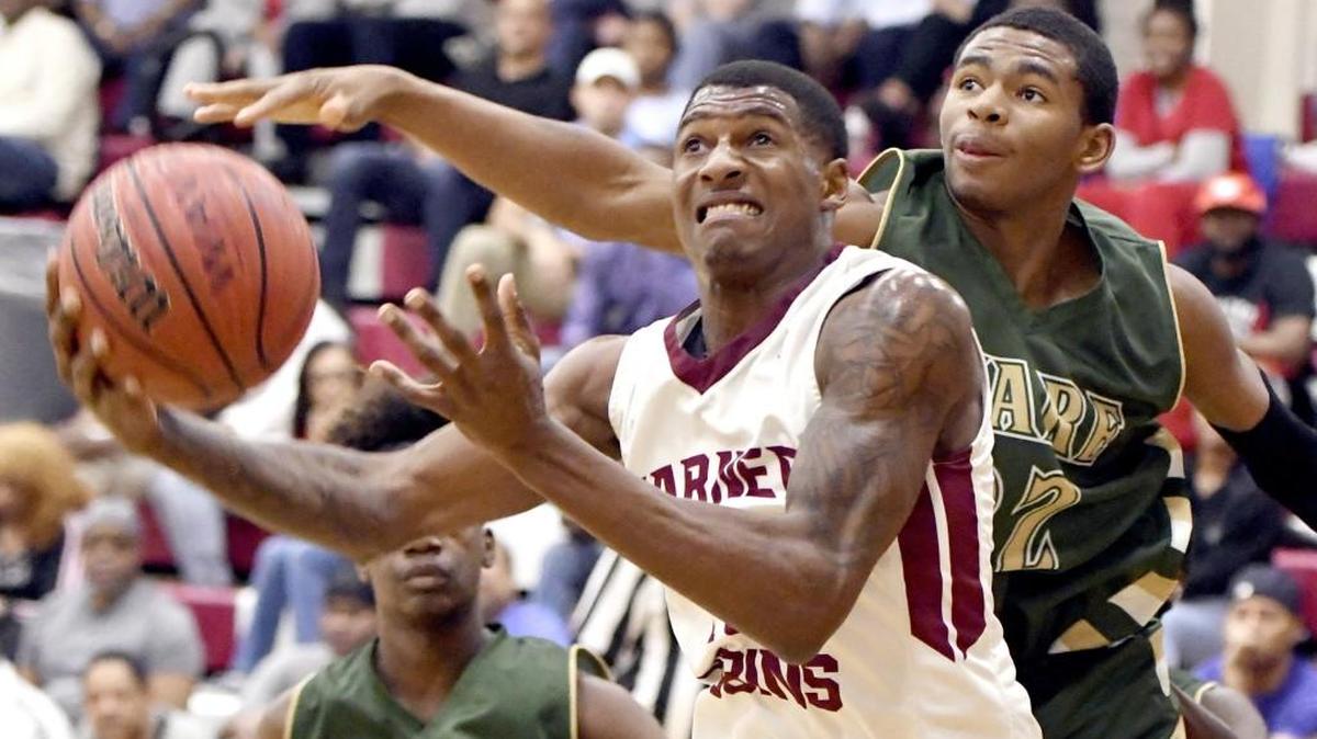 Warner Robins' Nelson Phillips (10) lays up a shot in the lane during the Demons' 96-63 win over Ware County in their GHSA 5A first round playoff game Feb. 16.