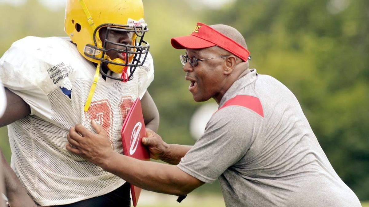 Head coach Bruce Mullen, right, and the Northeast Raiders take on Rutland on Friday at Thompson Stadium.