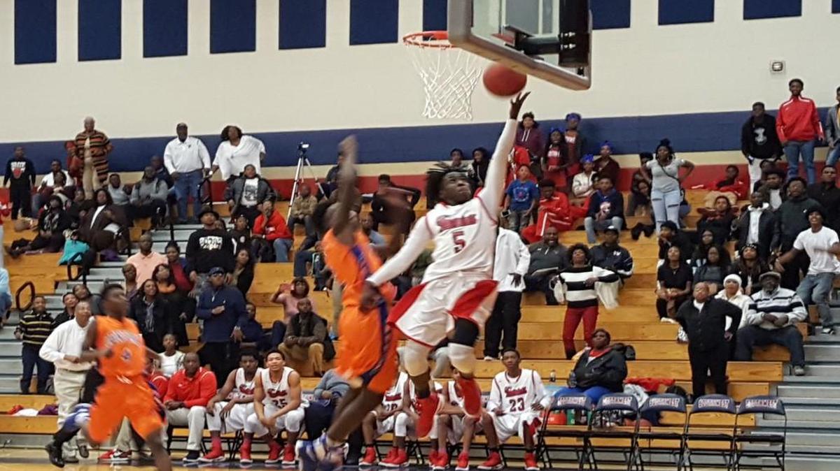 Southwest’s Tyrese Evans (5) goes to the basket to score in the final minute of the Patriots’ victory Saturday over Central.