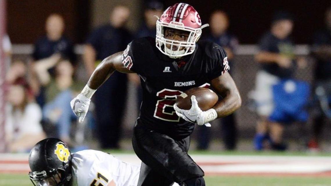 Warner Robins running back Jarius Burnette (20) finds running room and a first down during first half action against Harris County.