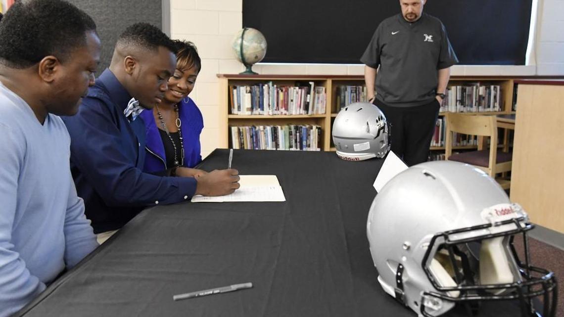 Houston County High School player Shane McCullough signed his national letter of intent to Berry College in the school's library Wednesday morning.