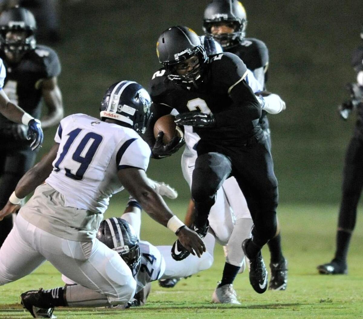 Mary Persons Tre Slaton finds a gap in the line against Spalding.