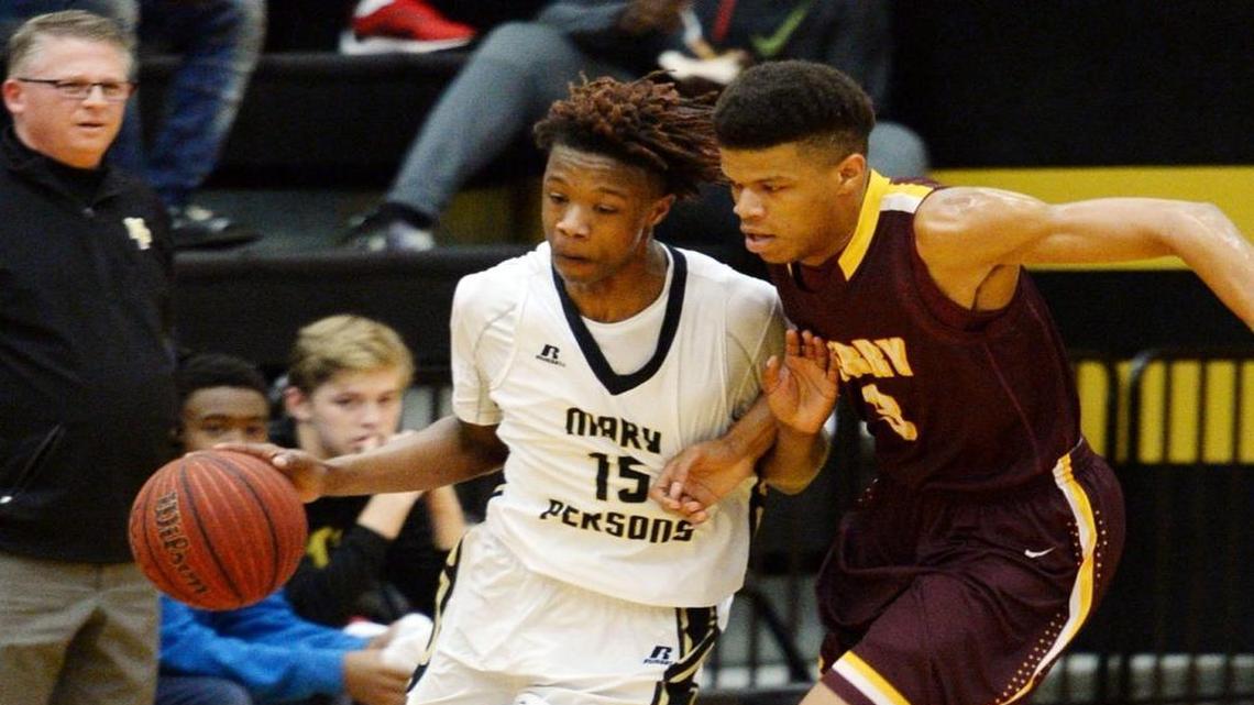 Mary Persons’ Cameron Holden (15) brings the ball down court before being called on a ball handling foul. Perry’s Jhimarre Brown (3) was defending. Mary Persons beat Perry 69-60.