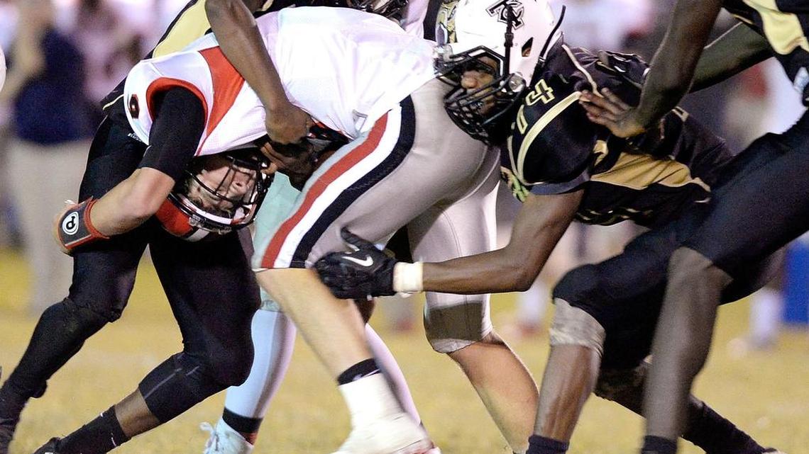 Twiggs County defenders tackle FPD quarterback Dalton Cox (6) during their game Friday night.