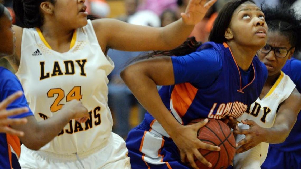 Central’s Jada Clowers (30) eyes the basket after coming up with her team’s rebound in the final seconds Saturday against Peach County.