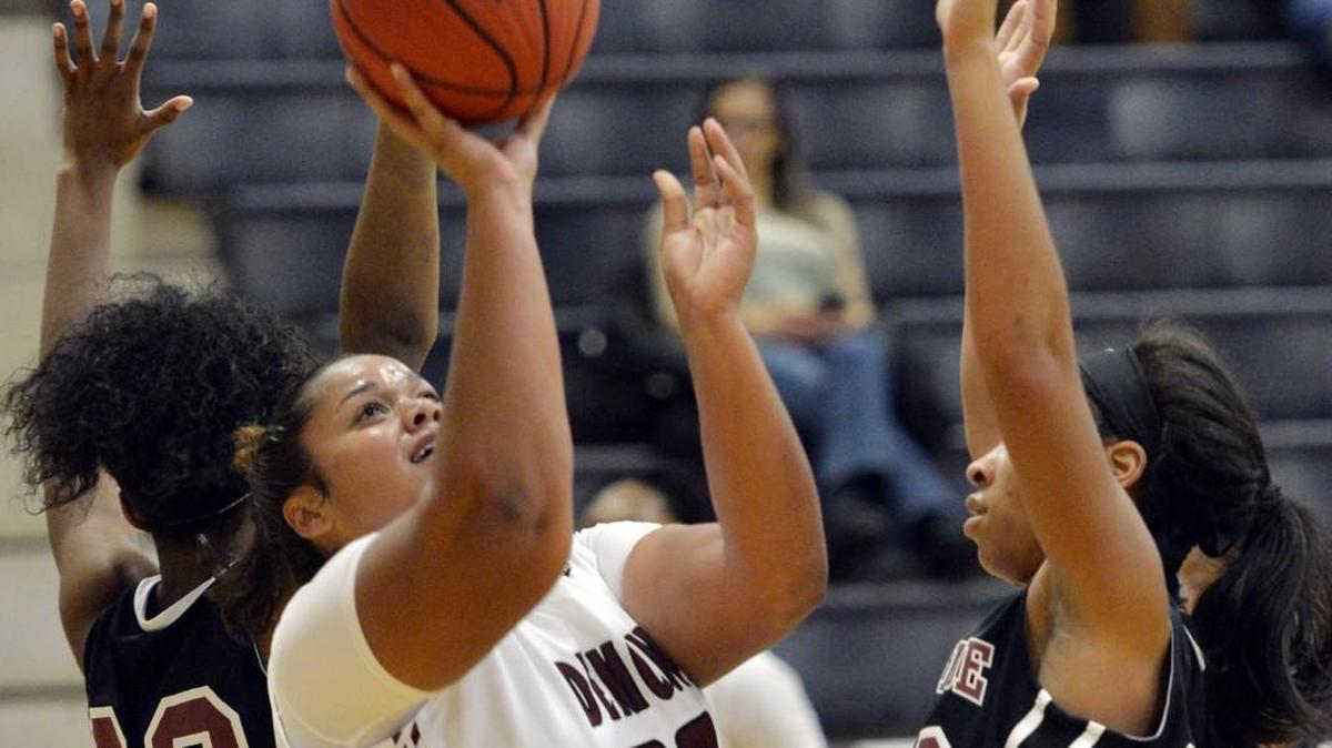 Warner Robins center Courtney Walker (20) moves in for a layup against Westside during a game this month.