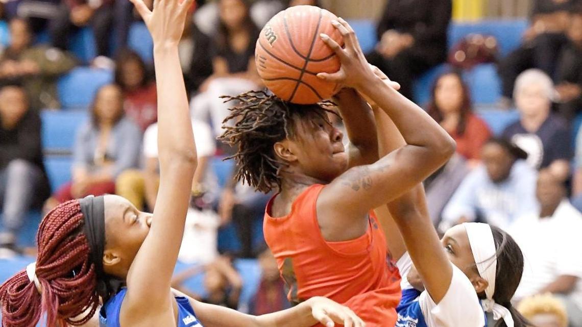 Macon County's Jasmine Larry (4) puts up a shot over during the Middle Georgia All-Star Basketball Classic Saturday at Tattnall Square Academy.