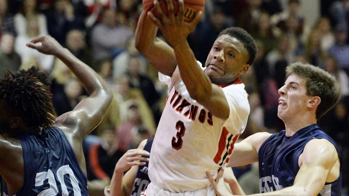 FPD's Armaun Smith (3) takes away a rebound from Stratford's Nate Brooks (20) and Nathan Hunt (30) during second half action. FPD beat Stratford, 60-47.