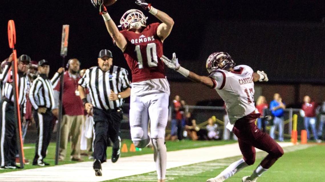 Warner Robins’ Tyler Fromm (10) catches a pass on the sideline in the GHSA Class 5A semifinal game Friday against Carver-Atlanta.