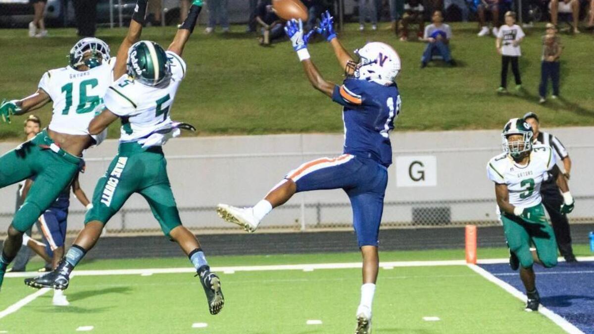 Northside’s Terrell Bryant (19) catches a touchdown pass in the first half of their game Friday night against Ware County