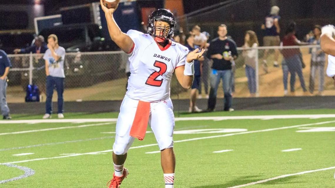 Macon County's K'Hari Lane (2) led the Bulldogs to the GHSA Region 4-1A title Friday, passing for 305 yards and five touchdowns.