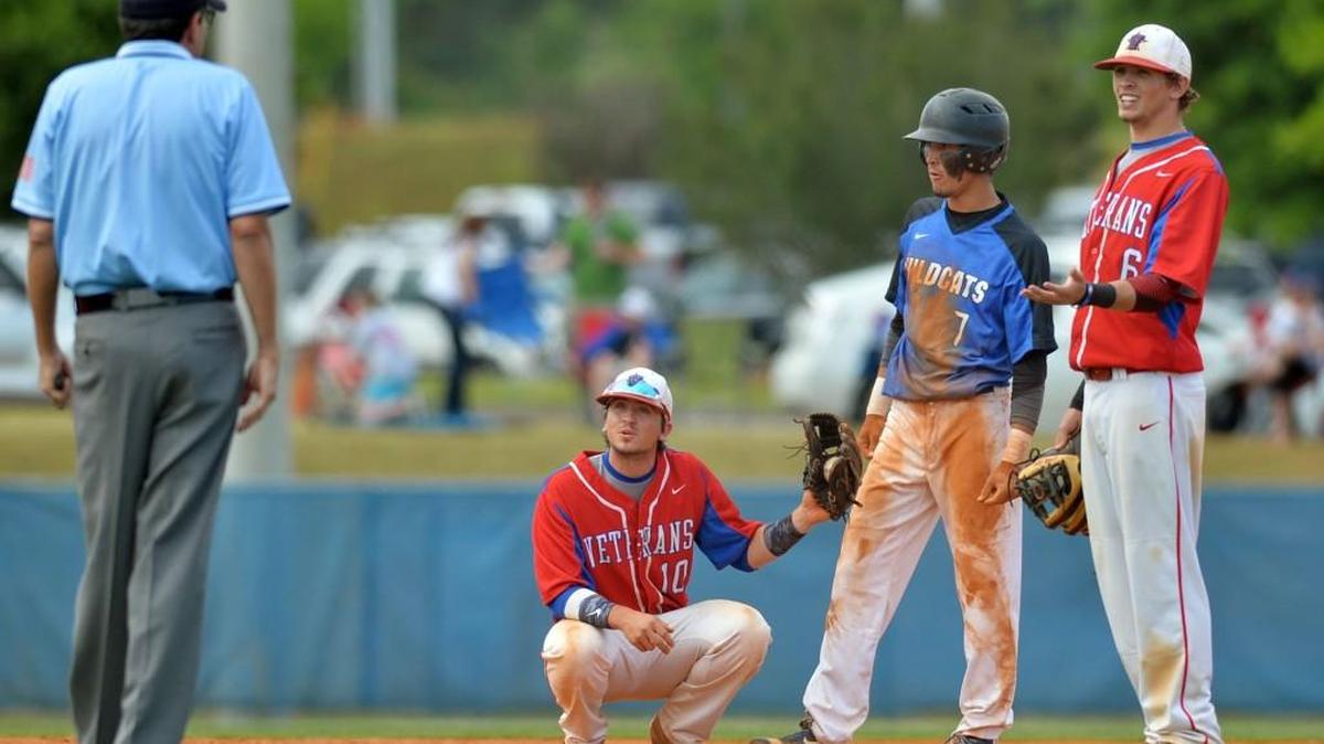 Veterans shortstop Tyler Daughtry (1) and second baseman Gabe Holt (6) appeal to reason after they said Locust Grove runner Odlanier Rodriguez during this season’s playoffs.