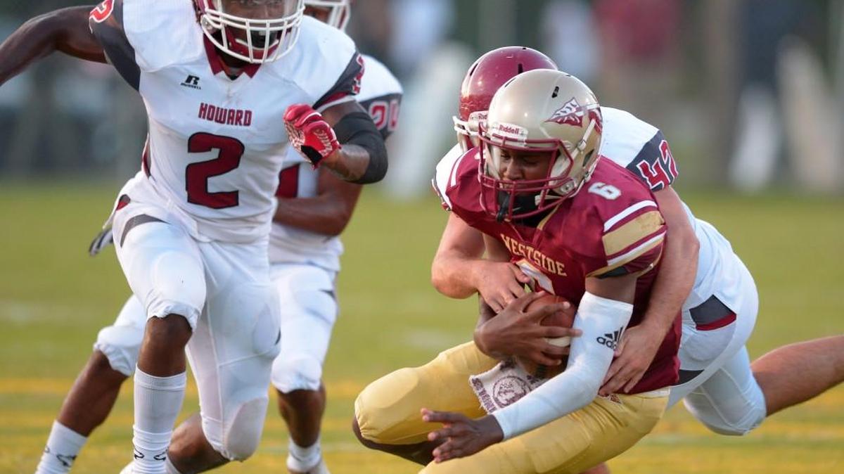 Westside quarterback Victor Dixon Jr. (front) and the Seminoles are 1-0 entering their game Friday against Southwest.