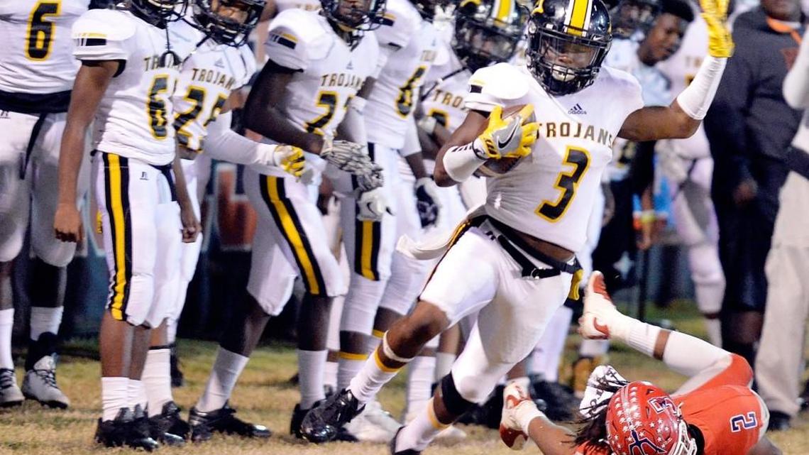 Peach County receiver Devonte Howard (3) runs down the sideline during the Trojans' game against Jackson Friday night.