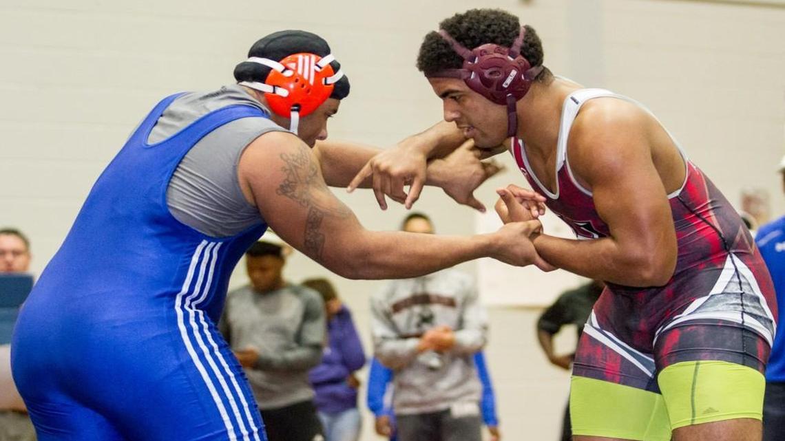 Central’s Javis Johnson, left, and Howard’s Gabriel Howard both qualified for the GHSA traditional wrestling championships.