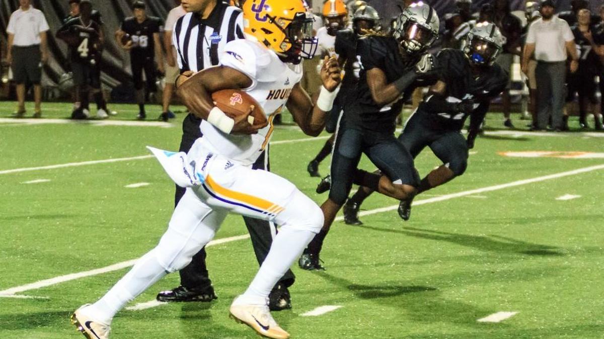 Jones County's Teldrick Ross (1) on a quarterback keeper runs 68 yards for the Greyhounds’ second touchdown against Houston County in the Corky Kell Classic at Mercer.