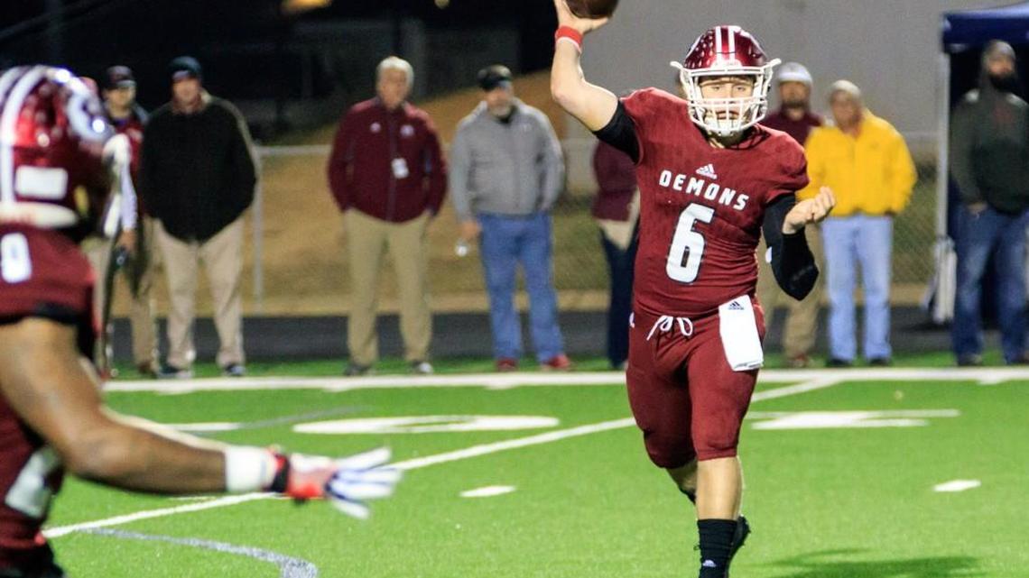 Warner Robins’ Dylan Fromm (6) throws a short pass against Carrolton In their GHSA Class 5A quarterfinal game Friday night.