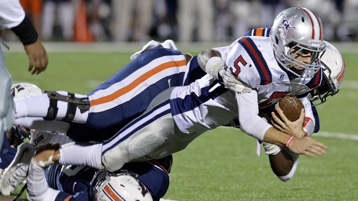 Northside defensive linemen Angel Camacho (99) and Jaylen Josey (90) drop Grovetown quarterback Taylor Youngblood for a loss during first-half action November 11, 2016.