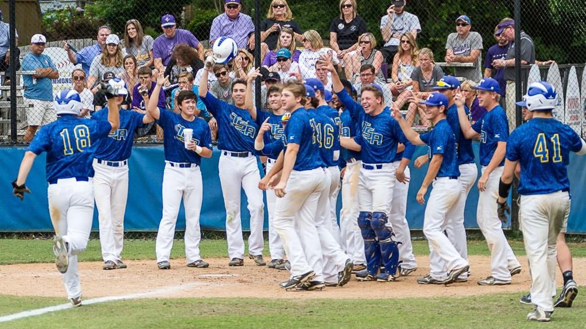 Tattnall Square’s Cory Bartholomew (18) is greeted at home plate after hitting a home run Monday against Calvary Day.