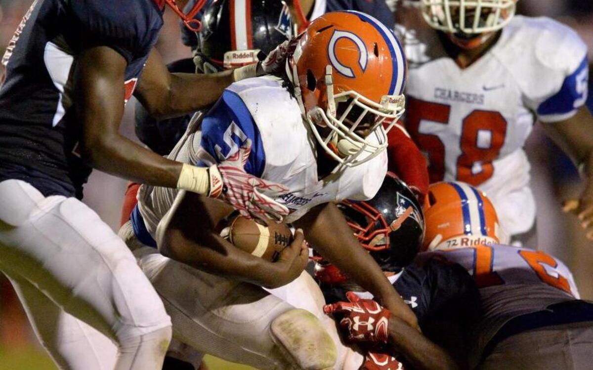 Central running back Antonio Sanders Jr. twists his way in to the end zone for touchdown in action Friday night.