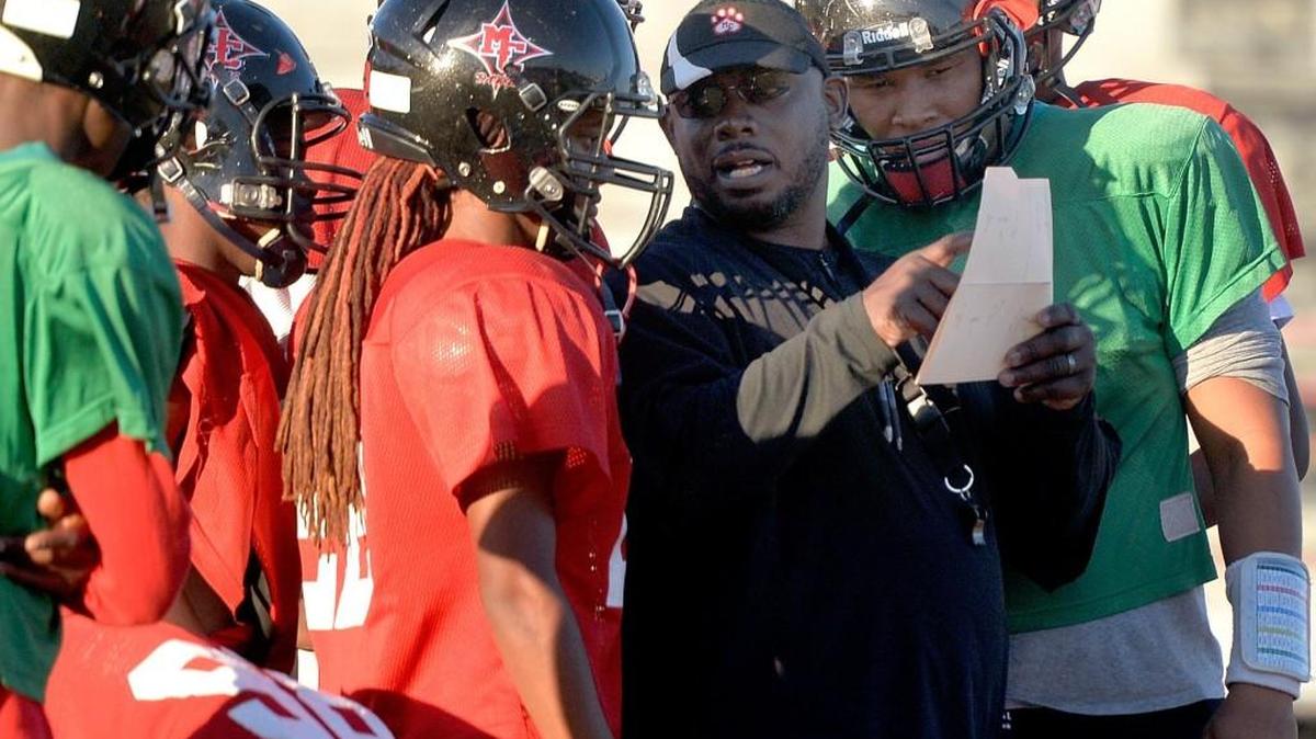 Macon County head coach Dexter Copeland calls a play during practice Tuesday afternoon.