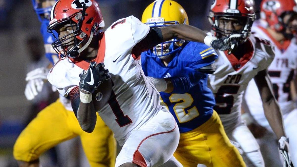 FPD's Titus Moore (1) runs with a pass from Dalton Cox for first down yardage during first half action against Tattnall. FPD beat Tattnall, 41-35.