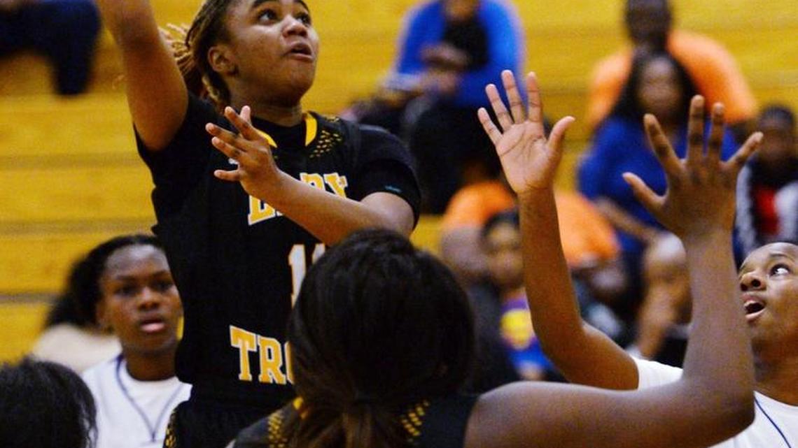 Peach County's Deja Holland (14) lifts a hook shot over the Central defense during second half action.