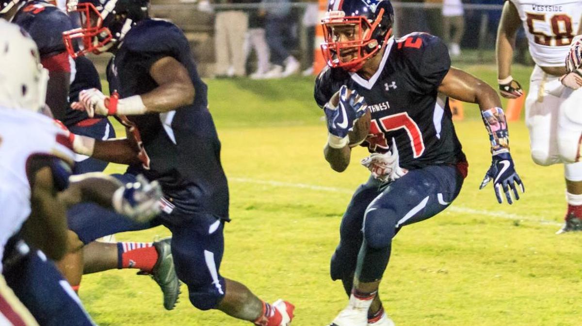 Southwest's Jaquavious Jones (27) breaks outside for a big gain against Westside.